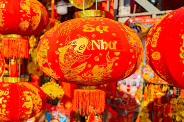 Naklejka premium The fair before the Lunar New Year. The Eastern New Year according to the lunar calendar. Sale of attributes and jewelry in Nha Trang in Vietnam.