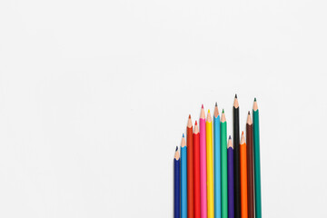 Different color pencils on white background