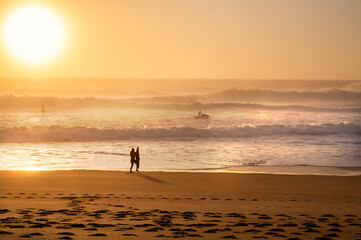 Fototapeta na wymiar Waves at sunset in Nazare in Portugal