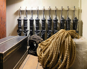 Marine equipment, ropes, anchors, weights and buoys on a boat. Ancient vessel stock. Old objects in...