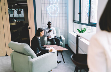 Fototapeta premium Diverse coworkers working in creative workplace