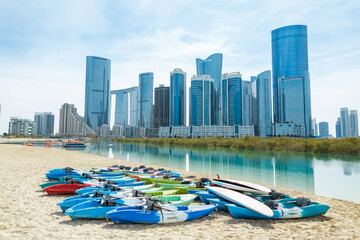 Modern beautiful technological city with glass business buildings, beach, sea and sup board....