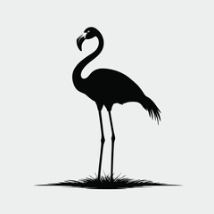 Obraz premium Silhouette of a flamingo standing gracefully on one leg against a plain background, showcasing its elegant posture and iconic shape.