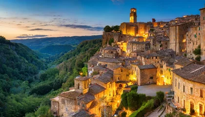 Poster panoramic of sorano in the evening sunset with old tradition buildings and illumination tuscany italy © Emanuel