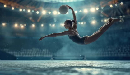 Zelfklevend Fotobehang Rhythmic gymnastics, performing with ball, sport arena © DB Media
