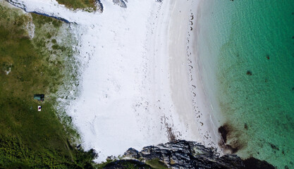 Blue , transparent and clear water Scotland uk near Arisaig Scottish Highlands beautiful white sandy beach Scottish tourist destination located south of Mallaig. Camping spot