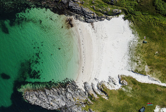 Blue , transparent and clear water Scotland uk near Arisaig Scottish Highlands beautiful white sandy beach Scottish tourist destination located south of Mallaig. Camping spot