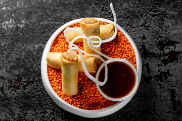 traditional vietnamese nems or deep fried spring rolls and dipping sauces