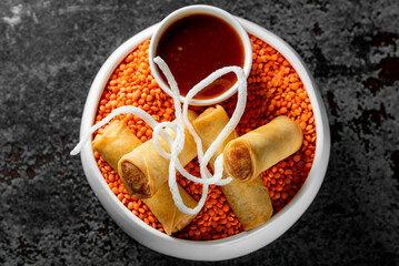 traditional vietnamese nems or deep fried spring rolls and dipping sauces