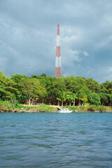 Shot of telecommunication tower placed in tropical vegetation in Chiapas, Mexico.