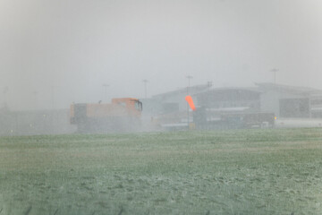 Leeds Bradford Airport LBA in snowy conditions as snow plough and gritters work