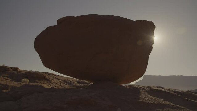 Sunbeam behind Elvis Rock at sunset / Utah, United States