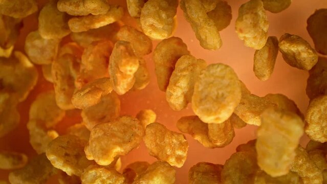 Super Slow Motion Shot of Flying Chicken Nuggets Towards Camera at 1000fps.
