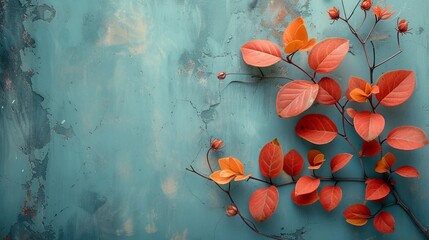 Red flowers and leaves against a turquoise wall