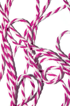 Wrapping Paper Stripy String Rope Close Up on White Background