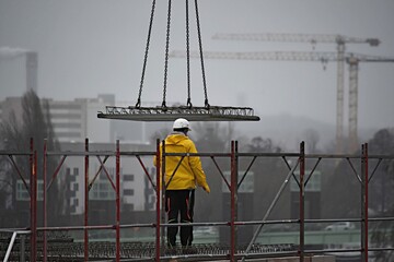  builders and crane delivery of building slabs