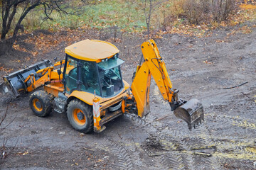 Excavator on a construction site, excavator ready to start earthwork, earthwork with excavator