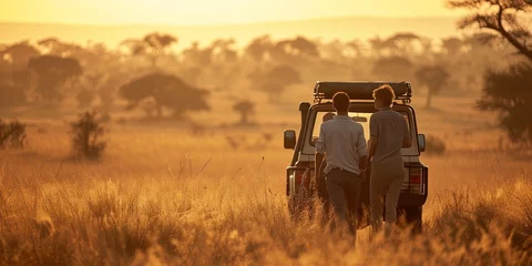 Foto op Canvas Couple exploring African grasslands during a safari expedition advanture © Brian