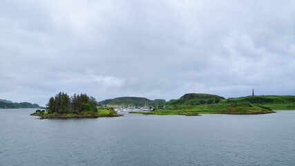 Moored boats in ocean hamlet, Inner Hebrides islands, Scotland seascape,  United Kingdom, travel Europe