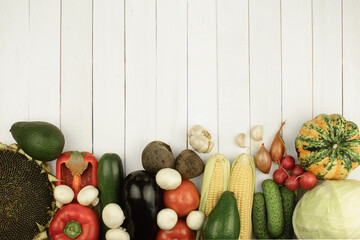 Fresh vegetables on a wooden background. Background with copy space