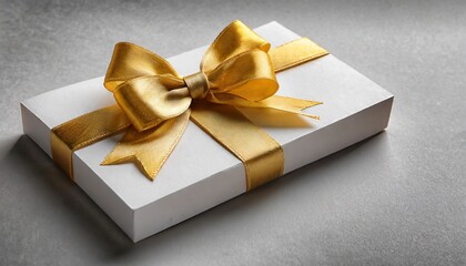 gift card with golden ribbon bow on white background