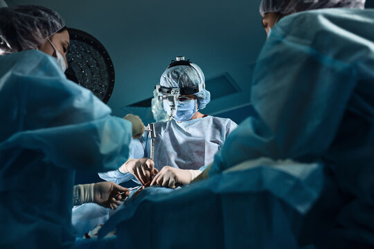 A shot of an emergency and a serious accident in the operating room, a team of surgeons makes an emergency operation to people in an accident. Saving lives, modern medetsina.