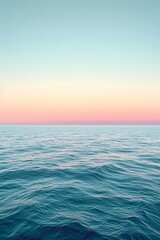Fototapeta premium Gradient sky tones merge seamlessly with tranquil sea shades, evoking a peaceful horizon