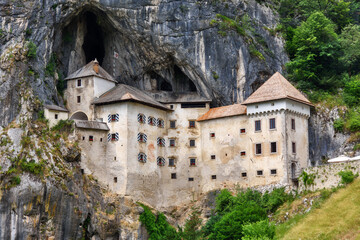 Fototapeta na wymiar Predjama, Slovenia - June 27, 2023: Predjama Castle in Slovenia, Europe. Renaissance castle built within a cave mouth in south central Slovenia.