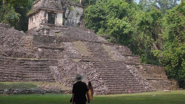 couple in Mayan ruins in Palenque, Chiapas, Mexico.