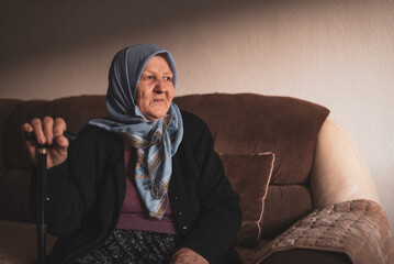 Beautiful face portrait of a happy Muslim grandmother in hijab.