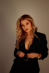 Fototapeta premium Portrait of a pretty sexy blonde with long hair and a cute look