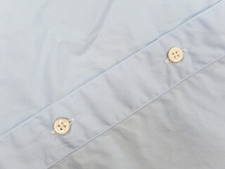 Mother of pearl buttons on blue