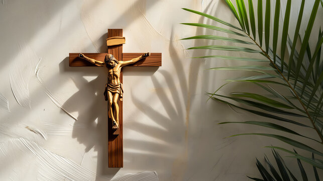 Crucifix with figure of Jesus, red candle and palm leaves on white background