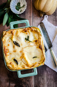 Pumpkin Lasagna in a colourful cooking pan on a wooden table