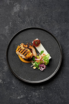Char grilled marinated chicken, lemongrass, kaffir lime & coconut sauce, compressed rice, pickled onion, cucumber & herb salad, chilli jam, toasted peanuts