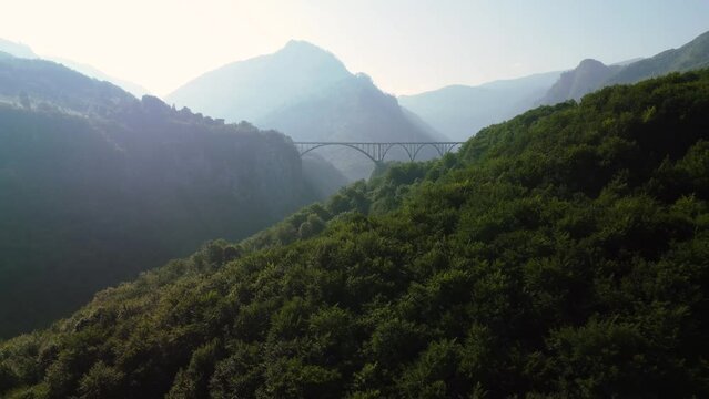 Aerial view of Durdevica Tara Bridge and Canyon on a foggy day at Zabljak, Durmitor Park