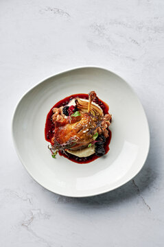 Roasted, confit duck leg, parsnip puree, spiced pork & fennel seed chipolata, roasted fennel bulb, duck jus, boysenberries