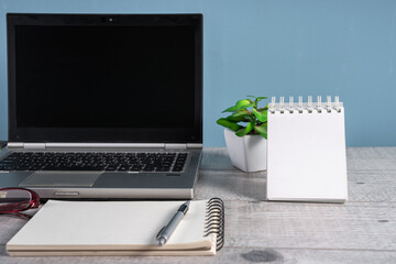 Laptop on desk in office, business concept