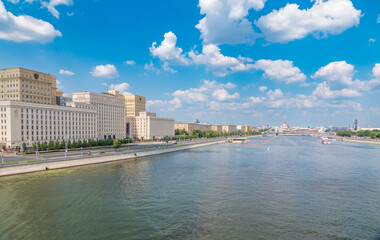 View of the Ministry of Defence of Russian Federation, and Moscow river embakment with cruise ships at sunset.