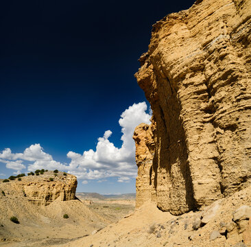 Cliffs, blue sky and clouds in a remote desert landscape near Guadalupe Chaco Ruins, Rio Puerco, New Mexico
