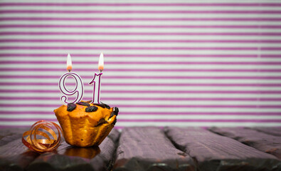 Birthday number 91. Date of birth with number of candles, copy space. Anniversary background with...