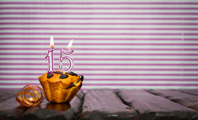 Birthday number 15. Date of birth with number of candles, copy space. Anniversary background with...