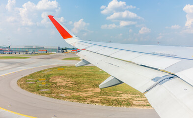 View from the airplane window during takeoff at Sheremetyevo airport at summer