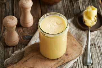 Ghee or clarified butter in a transparent glass jar