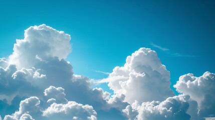 Fluffy white clouds on blue sky