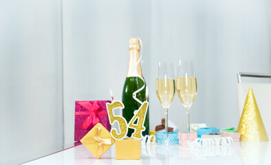Date of birth with number  54. Festive Champagne in glasses with gift boxes, anniversary postcard....