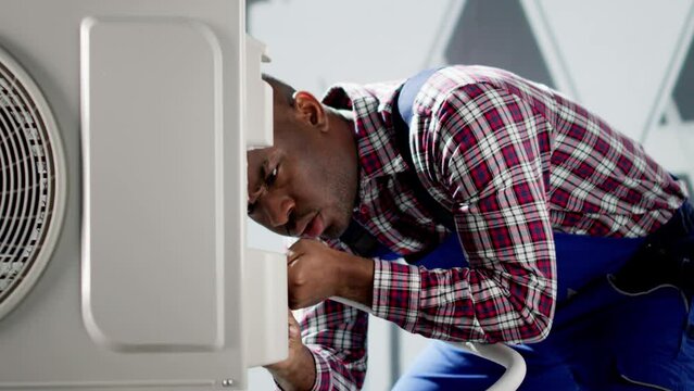 AC Electrician Technician Repairing Air Conditioner
