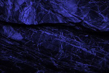 Fototapeta premium Dark stone navy granite texture. Close-up blue rock surface for banner ad design. Grunge abstract background with copy space