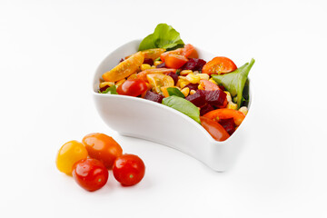 Salad with vegetables in a bowl isolated on a white background.