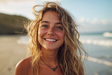 A beautiful young woman walks along the beach near the sea. Background with selective focus and copy space